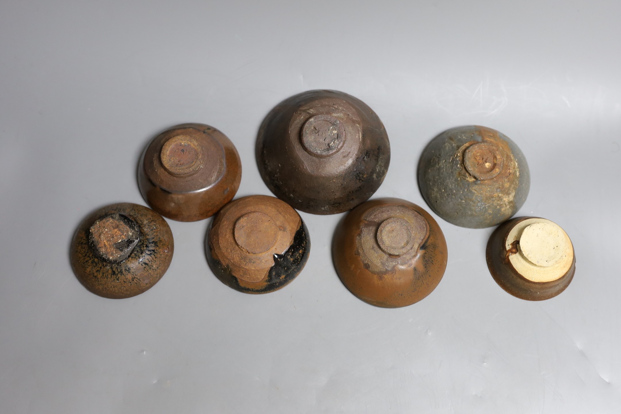 A group of Chinese Jian ware tea bowls, Song dynasty, largest 11.5 cms diameter, 7cm to 11.4cm diameter